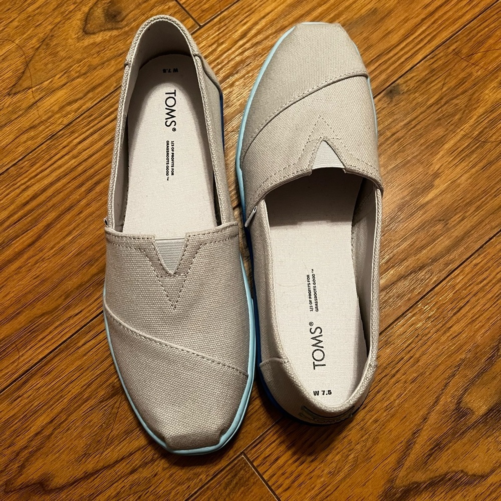 TOMS Light Gray Canvas Slip-Ons with Blue Sole